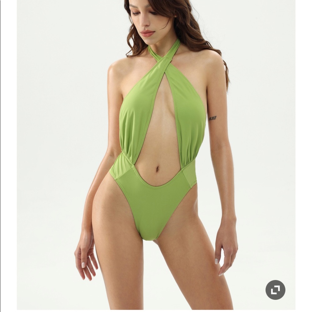 Cider one piece swimsuit. Twist top detail. Never worn. Size small.
